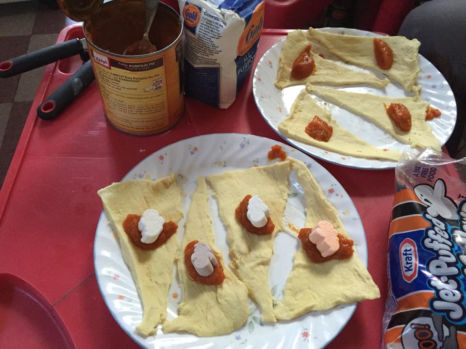 A spoonful of pumpkin pie mix and one ghost marshmallow per triangle is enough!